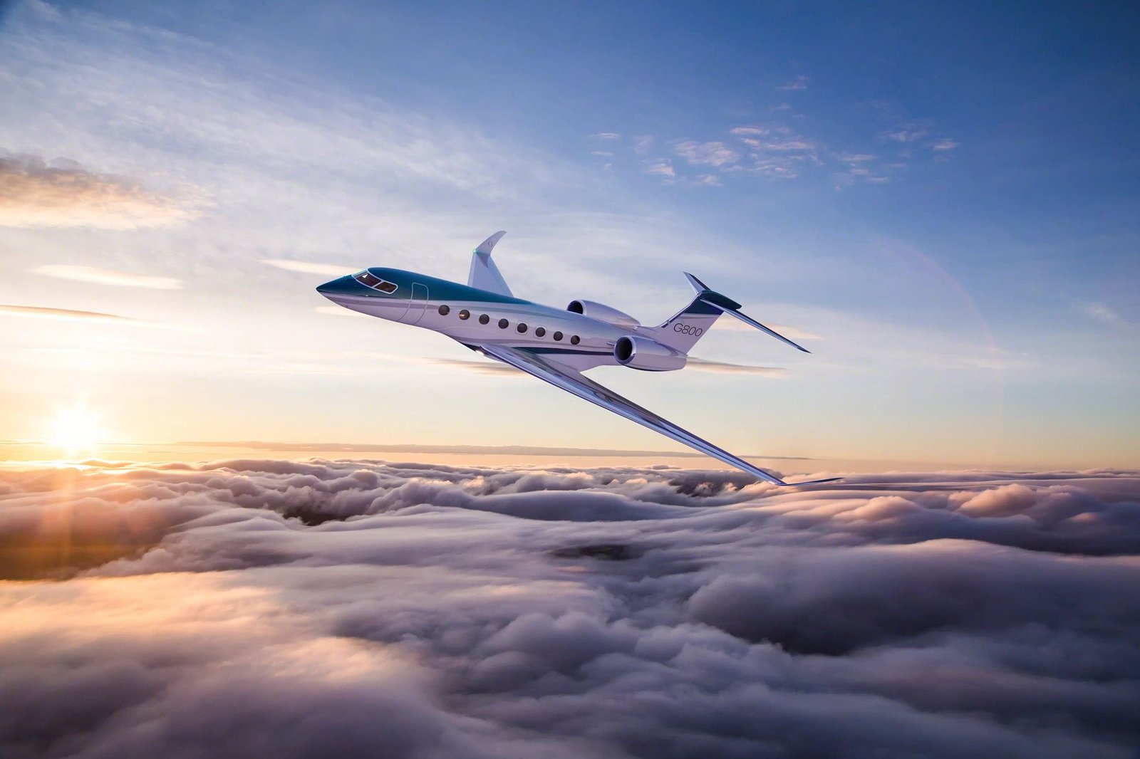 Gulfstream G800 flying above the clouds at sunrise