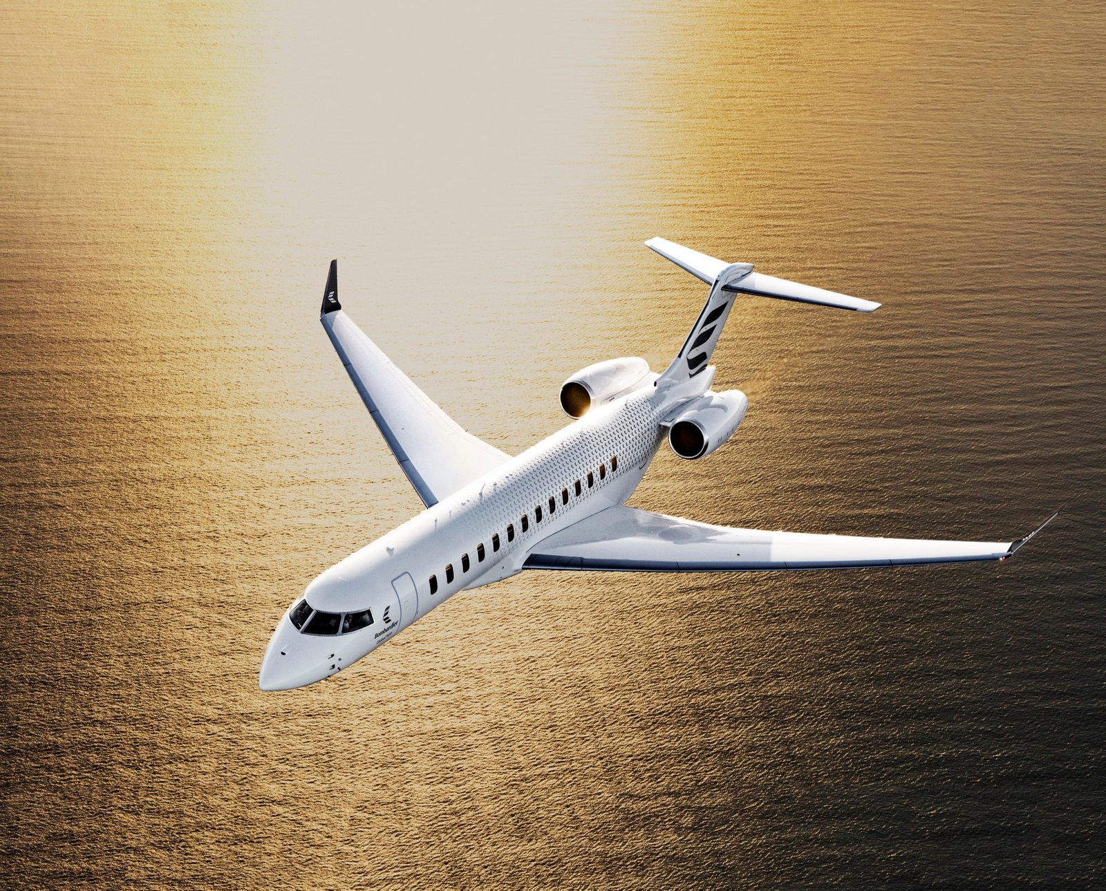 Bombardier Global 7500 flying over a golden sea
